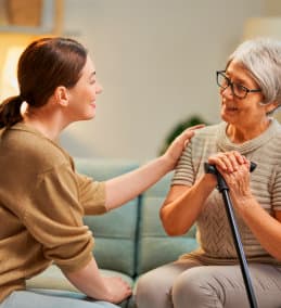 woman talking to senior woman