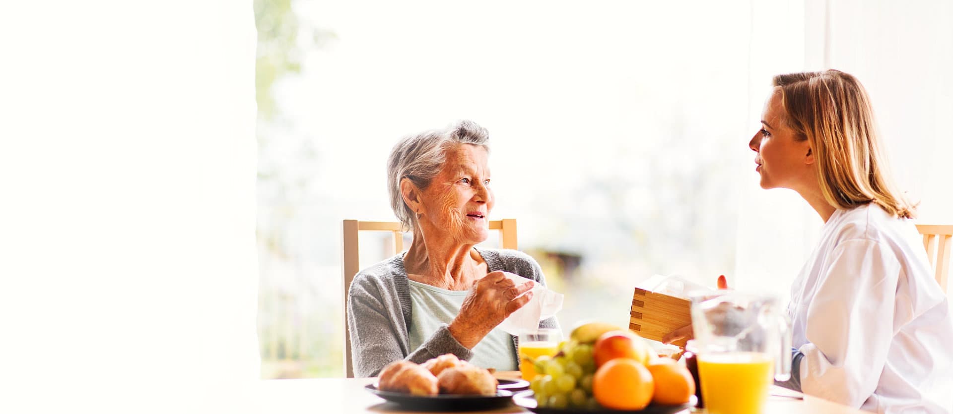 woman and senior woman talking