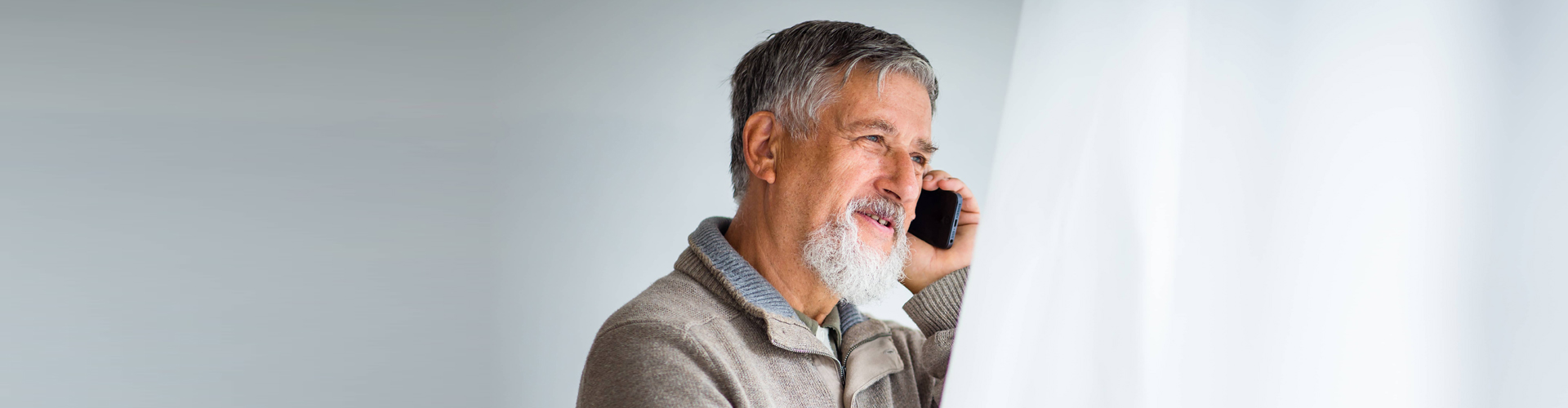 senior man on the phone